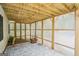 Covered stone patio with a wooden ceiling, privacy lattice, and view of the backyard at 1010 Capella Creek Way, Grayson, GA 30017