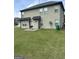 Spacious backyard featuring a well-maintained lawn and a patio area for outdoor grilling at 8109 Nolan Trl, Snellville, GA 30039
