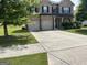 Beautiful two-story brick home with a spacious driveway and a well-manicured front yard at 8109 Nolan Trl, Snellville, GA 30039