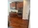 Kitchen features dark wood cabinets, stainless steel appliances and a subway tile backsplash at 8109 Nolan Trl, Snellville, GA 30039