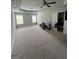 A large bedroom area featuring a ceiling fan and a large open space ready for personal touches at 8109 Nolan Trl, Snellville, GA 30039