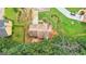 Bird's eye view of backyard, mature trees, landscaped lawn, and a home's roof at 2580 Star Ln, Decatur, GA 30034