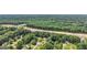 Scenic view of homes situated near a highway and surrounded by a lush green forest, combining accessibility with nature at 2580 Star Ln, Decatur, GA 30034
