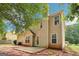 Back exterior of the two-story home with patio space and view of yard at 2580 Star Ln, Decatur, GA 30034