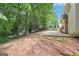 Expansive backyard featuring a concrete patio with lush greenery and mature trees, perfect for outdoor activities at 2580 Star Ln, Decatur, GA 30034
