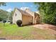 View of backyard and side of home, showcasing the outdoor space and potential for gardening or recreation at 2580 Star Ln, Decatur, GA 30034