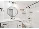 Modern bathroom with white cabinets, matte black fixtures, and bathtub shower combo at 2580 Star Ln, Decatur, GA 30034