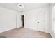 Bright bedroom featuring neutral carpet, white trim, and ceiling fan at 2580 Star Ln, Decatur, GA 30034