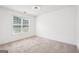 Bright bedroom with carpet floors, ceiling fan, and natural light from the window at 2580 Star Ln, Decatur, GA 30034
