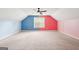 Spacious bonus room with colorful blue and pink walls and a ceiling fan at 2580 Star Ln, Decatur, GA 30034