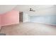 Open bonus room with carpet, ceiling fan, and vaulted ceilings provides ample space at 2580 Star Ln, Decatur, GA 30034