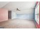 Bright bonus room with plush carpet and ceiling fan offers versatile space for various activities at 2580 Star Ln, Decatur, GA 30034
