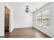 Bright Dining room with white trim, wood floors, a modern light fixture, and large window at 2580 Star Ln, Decatur, GA 30034
