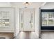Bright entryway featuring luxury vinyl plank flooring, white trim, and transom windows at 2580 Star Ln, Decatur, GA 30034