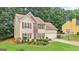 Charming two-story home with brick and siding, complemented by a well-manicured lawn and mature trees at 2580 Star Ln, Decatur, GA 30034
