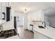 Bright kitchen features stainless steel appliances, white cabinets, modern hardware, white countertops, and wood look flooring at 2580 Star Ln, Decatur, GA 30034