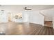 Open living room shows wood-look floors, connecting to the kitchen and stairs to the second floor at 2580 Star Ln, Decatur, GA 30034