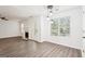 Living room featuring wood-look flooring, fireplace, and natural light at 2580 Star Ln, Decatur, GA 30034