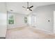A bright, airy main bedroom with two large windows and neutral decor at 2580 Star Ln, Decatur, GA 30034