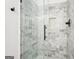 Newly tiled shower with glass surround, rainfall shower head, and built-in niche at 2580 Star Ln, Decatur, GA 30034