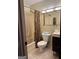 Bathroom with a shower-tub combo, toilet, and sink with vanity at 6875 Timberclair Ct, Lithonia, GA 30058