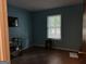 Bedroom with ample light from large window and built in storage shelving at 6875 Timberclair Ct, Lithonia, GA 30058
