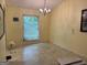 The dining room features natural light and a modern chandelier at 6875 Timberclair Ct, Lithonia, GA 30058