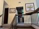View of the upstairs hallway showcasing access to the kitchen and bedrooms at 6875 Timberclair Ct, Lithonia, GA 30058