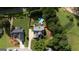 Aerial view of a home and lot with an above-ground pool in the fenced backyard and mature trees at 53 Denny Ln, Dallas, GA 30157