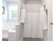 Bright bathroom with shower stall and white shower curtain, white decorative towels, and a large soaking tub at 53 Denny Ln, Dallas, GA 30157