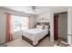 Bright bedroom with a comfortable bed, large window, and a decorative wall art piece at 53 Denny Ln, Dallas, GA 30157