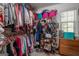 Walk-in closet with custom shelving and storage for clothing, shoes and storage bins at 53 Denny Ln, Dallas, GA 30157