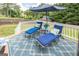 Relaxing deck with lounge chairs, an area rug, decorative pillows, and potted plants; ideal for outdoor relaxation at 53 Denny Ln, Dallas, GA 30157