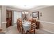 Traditional dining room featuring a set table, complemented by a chandelier and natural light, perfect for dining at 53 Denny Ln, Dallas, GA 30157