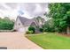 View of a well-maintained home with an attached garage, complemented by a manicured lawn and landscaping at 53 Denny Ln, Dallas, GA 30157