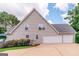Exterior of home with three-car garage, and well-maintained landscaping at 53 Denny Ln, Dallas, GA 30157