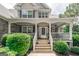 Charming home showcasing a welcoming front porch with decorative plants and a cozy seating area at 53 Denny Ln, Dallas, GA 30157