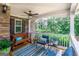 Relaxing front porch with comfortable seating, a ceiling fan, and views of the surrounding greenery at 53 Denny Ln, Dallas, GA 30157