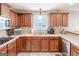 The kitchen has wooden cabinets, stainless steel appliances, and ample counter space at 53 Denny Ln, Dallas, GA 30157