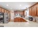 Well-equipped kitchen features stainless steel appliances, wood cabinets, and ample counter space for cooking at 53 Denny Ln, Dallas, GA 30157
