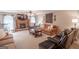 Warm and inviting living room features a fireplace, a ceiling fan, and plenty of seating for a cozy atmosphere at 53 Denny Ln, Dallas, GA 30157