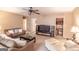 Comfortable living room with neutral colors, ceiling fan, and access to a kitchenette area at 53 Denny Ln, Dallas, GA 30157