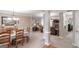 Open-concept living area showcases a dining space and living room with a fireplace, seamlessly connected at 53 Denny Ln, Dallas, GA 30157