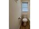 This compact bathroom features modern fixtures and a window for natural light at 110 Riley Ave, Fayetteville, GA 30214