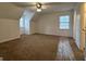 Cozy bedroom offering ample space, carpeted floors, and natural light from a window at 110 Riley Ave, Fayetteville, GA 30214