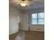 Well-lit bedroom with a ceiling fan and a window that fills the room with natural light at 110 Riley Ave, Fayetteville, GA 30214