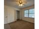 Standard bedroom featuring neutral walls and carpet, double windows, and closet at 110 Riley Ave, Fayetteville, GA 30214