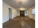 Cozy living room featuring a brick fireplace, built-in shelving, and large windows for natural light at 110 Riley Ave, Fayetteville, GA 30214