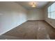Spacious living room featuring neutral carpeting and a large window providing plenty of natural light at 110 Riley Ave, Fayetteville, GA 30214