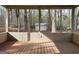 Inviting screened porch with a wooden deck, perfect for relaxing outdoors at 110 Riley Ave, Fayetteville, GA 30214